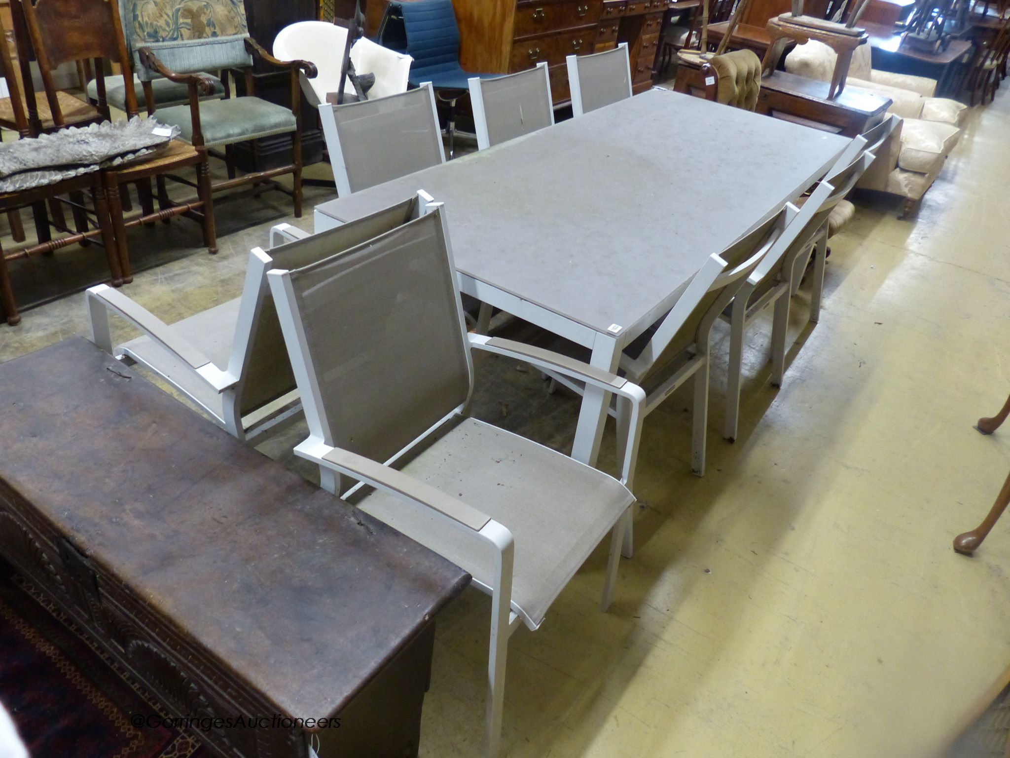 A modern Westminster Furniture aluminium and glass rectangular garden table, width 220cm, depth 92cm, height 75cm and eight chairs